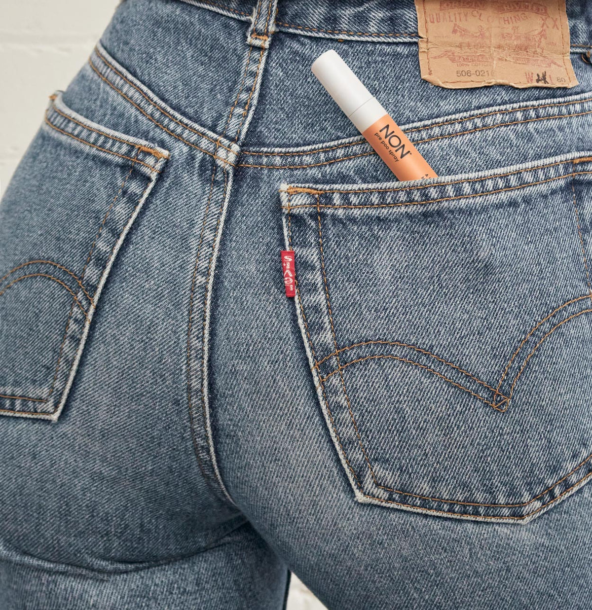 NON pre poo toilet spray travel size in back jean pocket